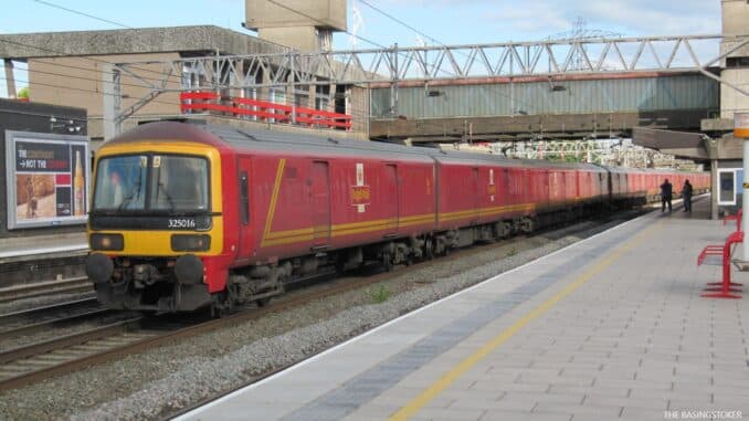 Two young men were arrested inside a mail train and charged with theft